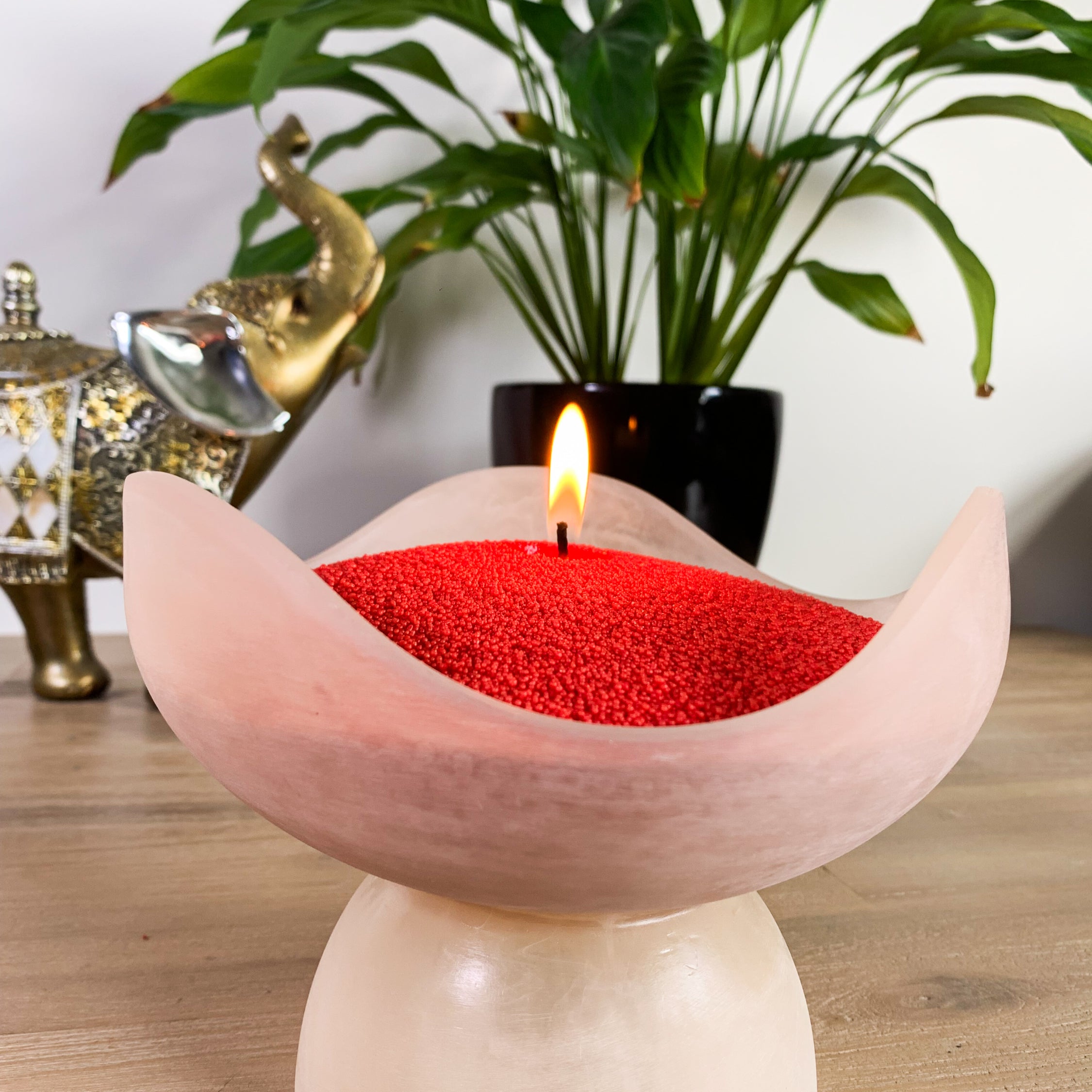 Decorative candle with red sand wax. Unique and striking red candle 