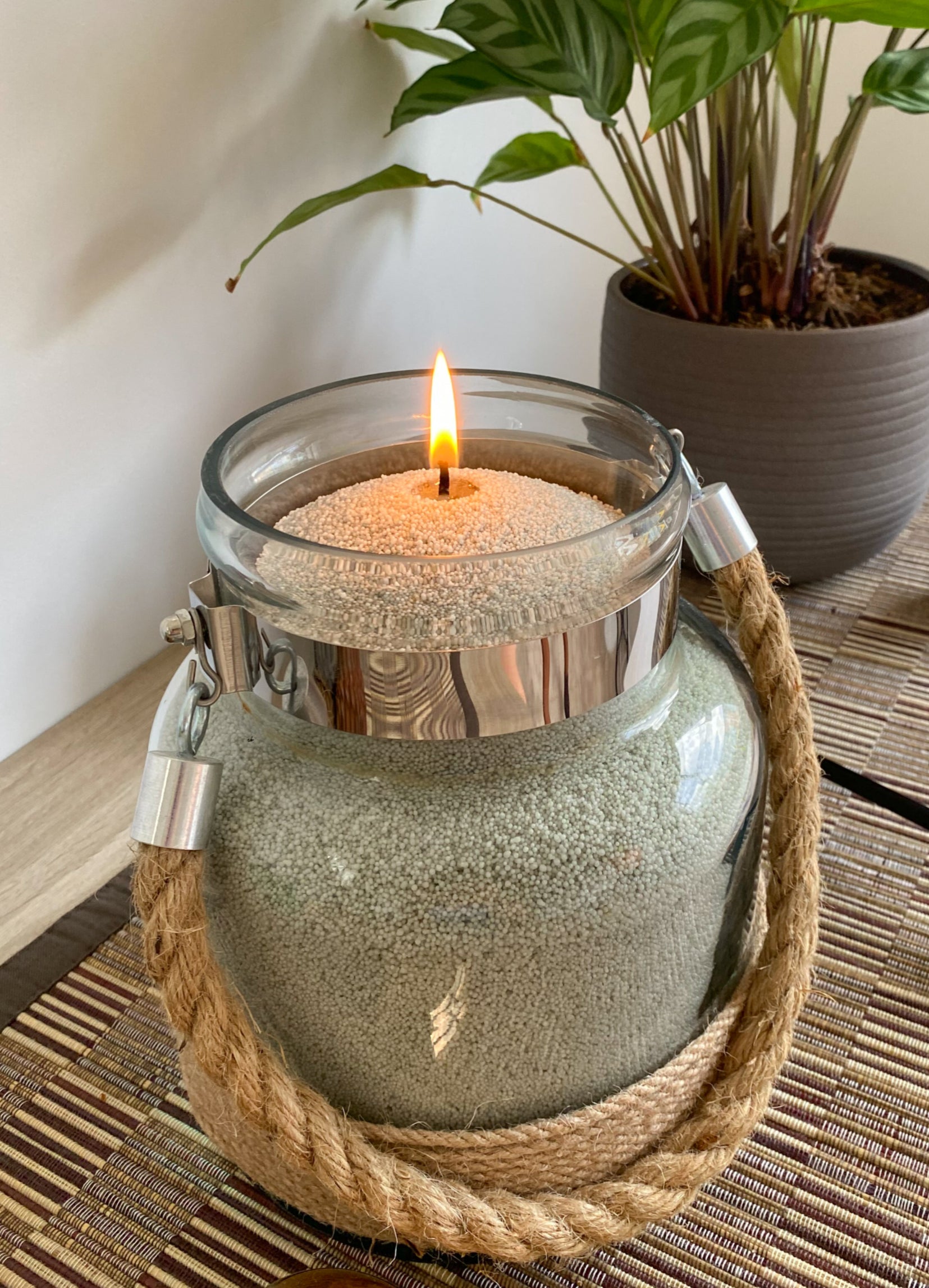 Sage coloured sand wax in glass jar. Versatile and unique candle experience
