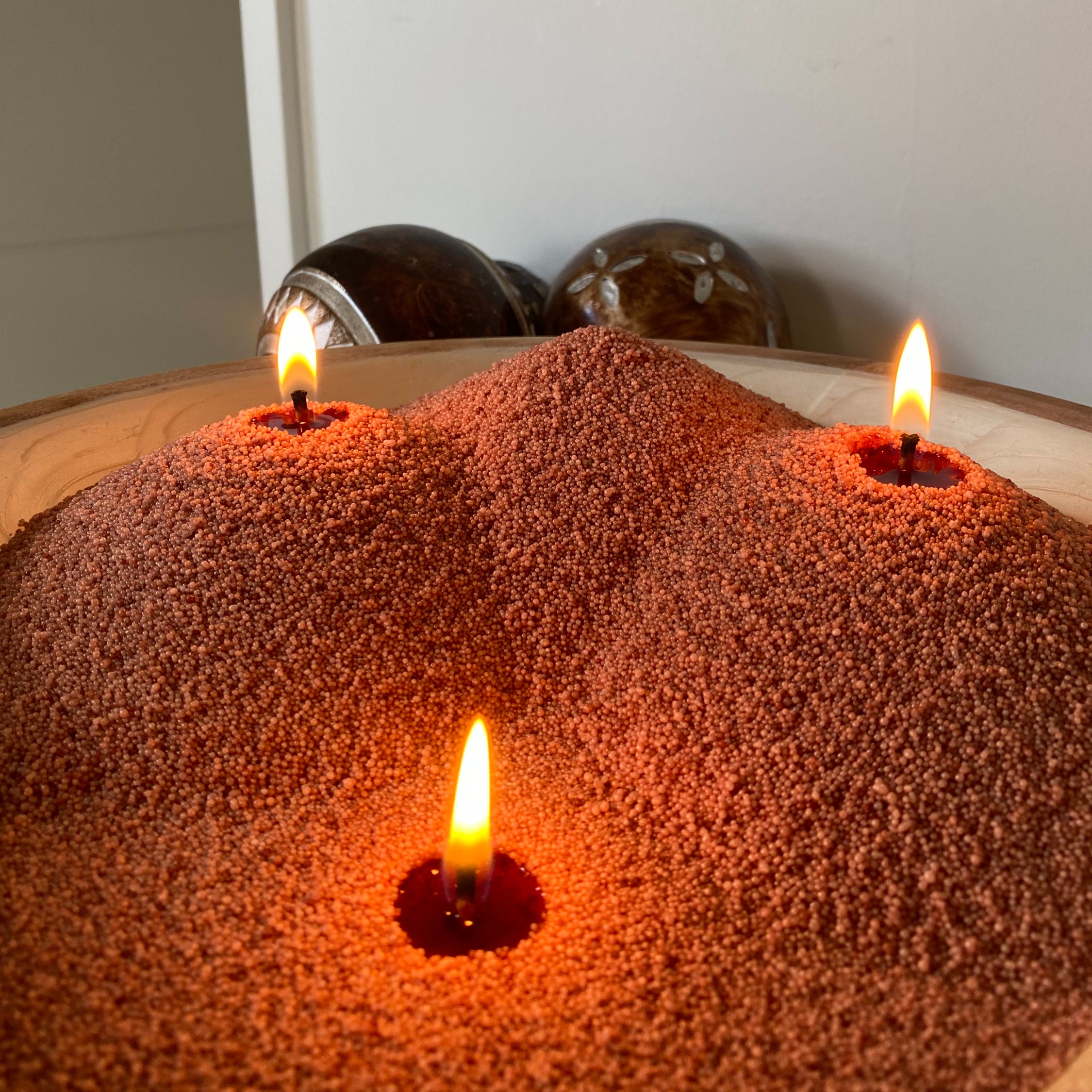 Rustic sandwax formed in mounds. A unique candle centrepiece