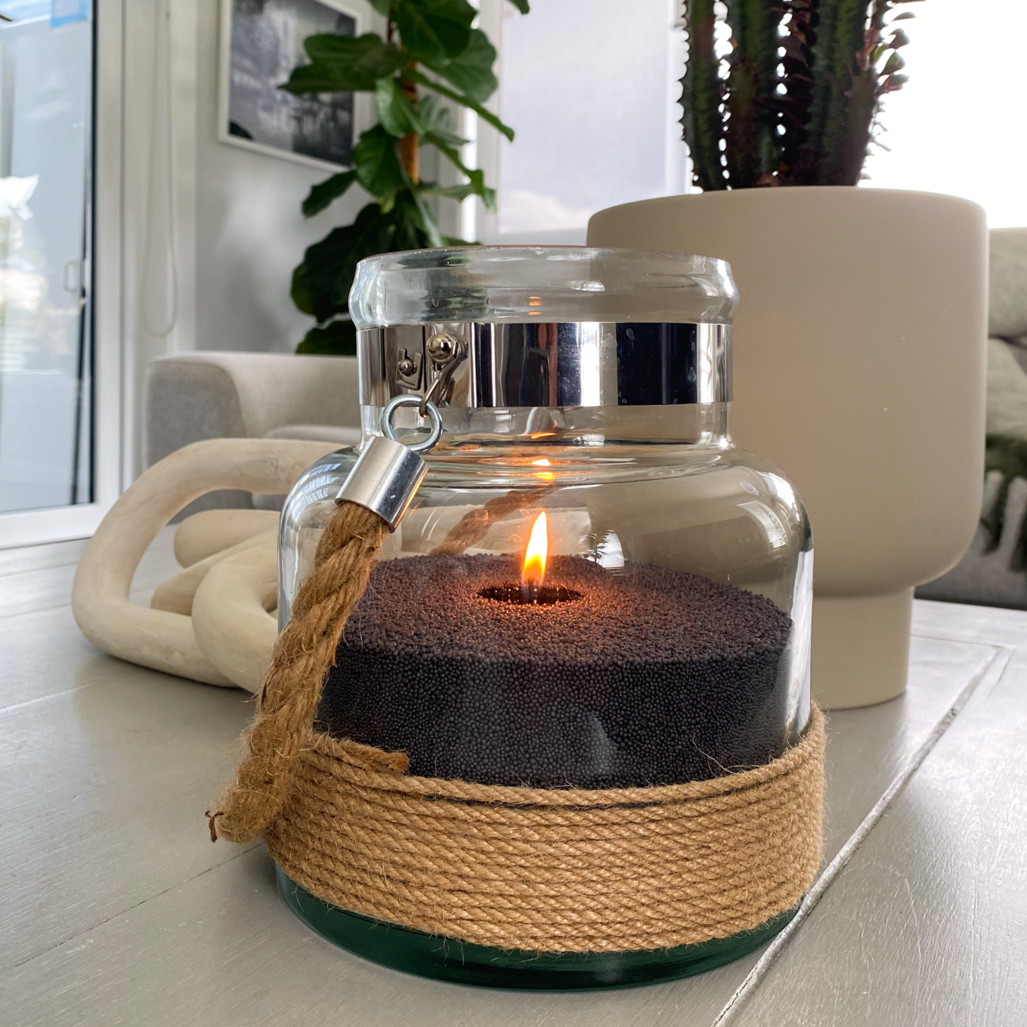 Unique charcoal coloured sandwax. Perfect in your living room space with a glass vessel. 