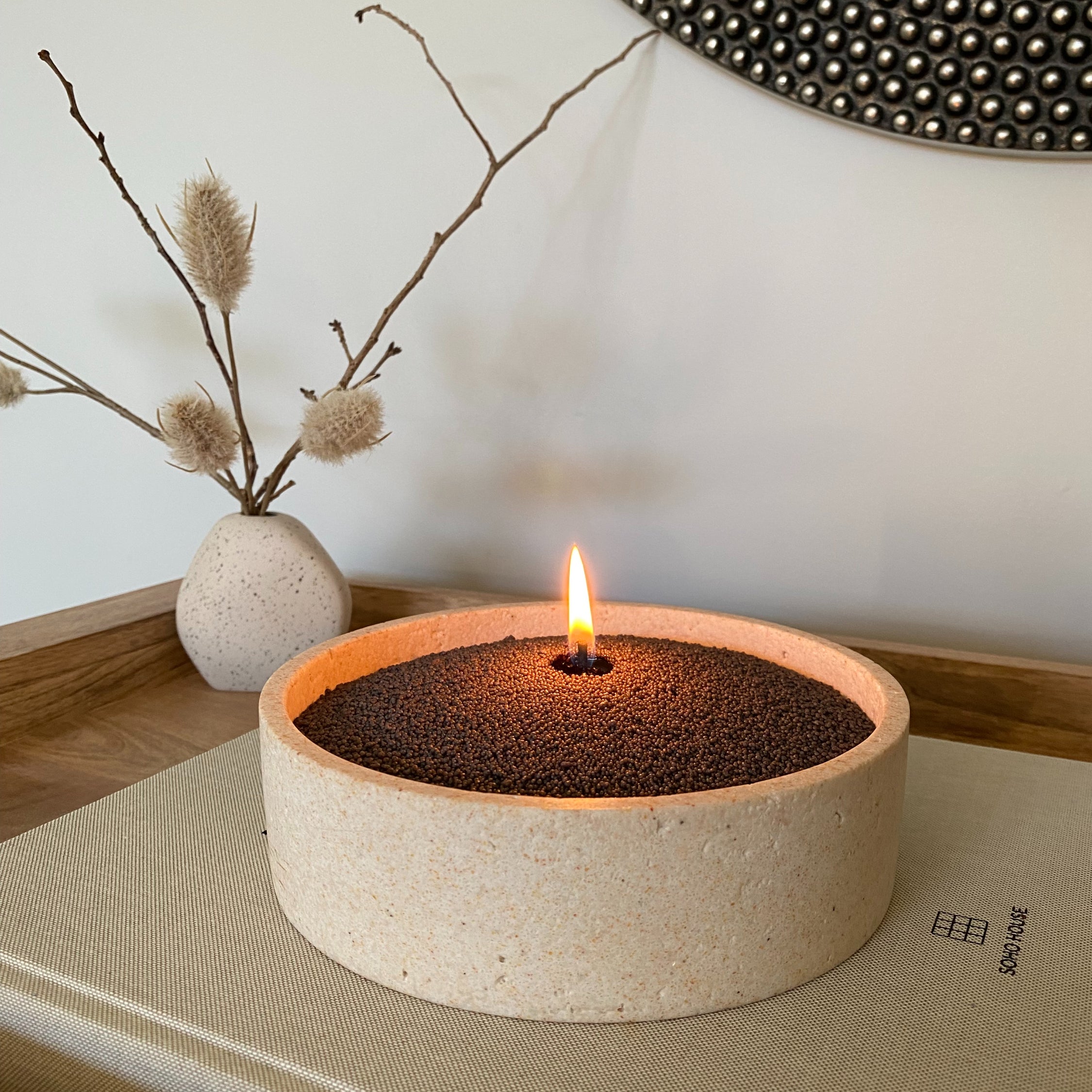 Ceramic bowl with charcoal coloured sandwax bringing out the woody tones in your interior space.